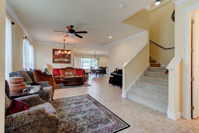 1703 Frogs Leap Ct, Port Orange, FL 32128 - living area featuring stairway, tile patterned floors, baseboards, ornamental molding, and ceiling fan with notable chandelier