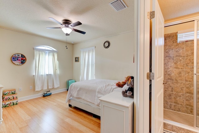 1703 Frogs Leap Ct, Port Orange, FL 32128 - bedroom featuring ceiling fan, a textured ceiling, visible vents, and light wood-type flooring