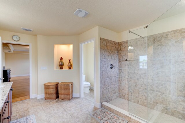 1703 Frogs Leap Ct, Port Orange, FL 32128 - bathroom with a shower stall, visible vents, toilet, tile patterned floors, and vanity