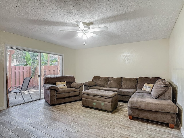 95 Moonstone Ct, Port Orange, FL 32129 - living area featuring a ceiling fan, light wood-type flooring, and a textured ceiling