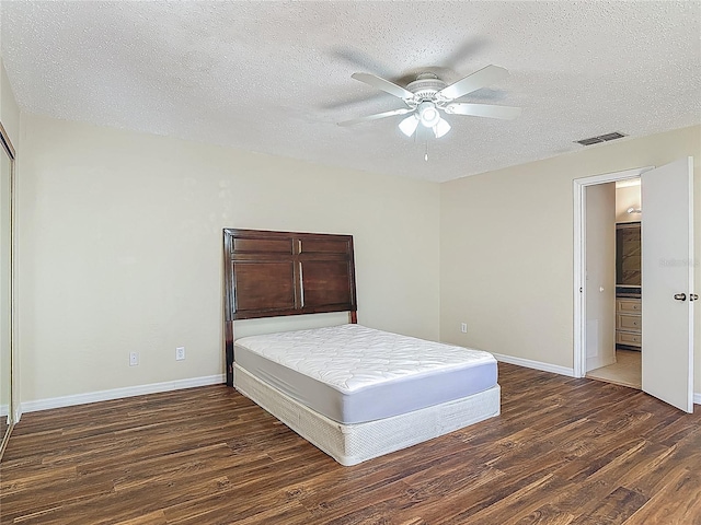 95 Moonstone Ct, Port Orange, FL 32129 - bedroom featuring wood finished floors, a textured ceiling, baseboards, and ceiling fan