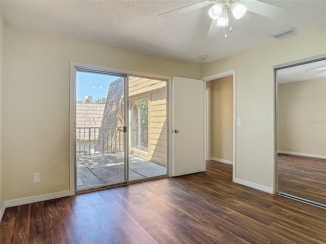 95 Moonstone Ct, Port Orange, FL 32129 - unfurnished bedroom featuring access to outside, wood finished floors, a textured ceiling, baseboards, and a ceiling fan