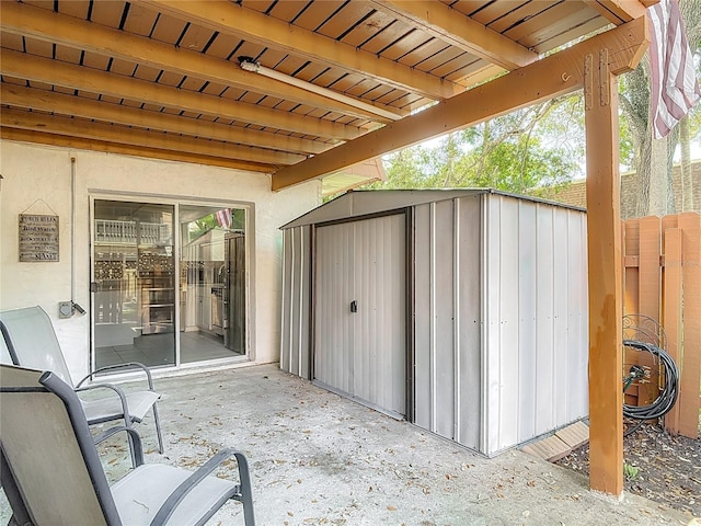 95 Moonstone Ct, Port Orange, FL 32129 - view of patio with a storage unit, an outbuilding, and fence