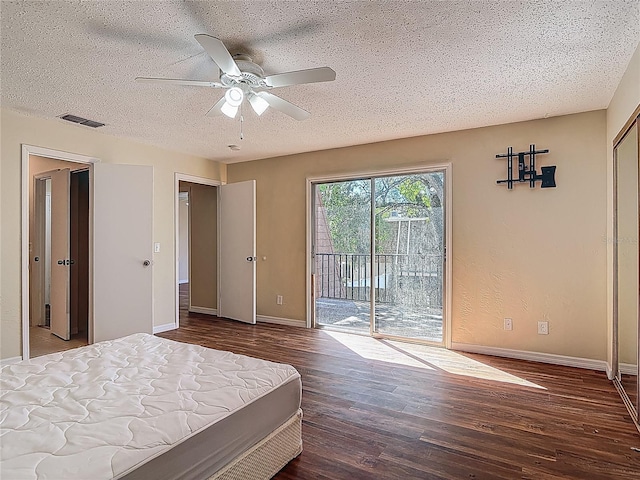 95 Moonstone Ct, Port Orange, FL 32129 - bedroom with access to exterior, wood finished floors, baseboards, a textured ceiling, and a ceiling fan