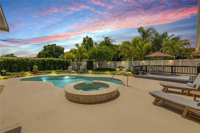 2548 E Compton St, Orlando, FL 32806 - view of swimming pool featuring a fenced backyard, a patio, an outdoor structure, and a shed