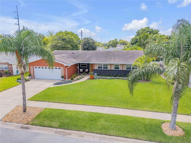 2548 E Compton St, Orlando, FL 32806 - ranch-style home featuring concrete driveway, an attached garage, and a front yard