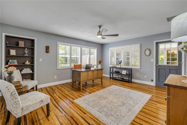 2548 E Compton St, Orlando, FL 32806 - home office with baseboards, light wood-style floors, ceiling fan, and a wealth of natural light