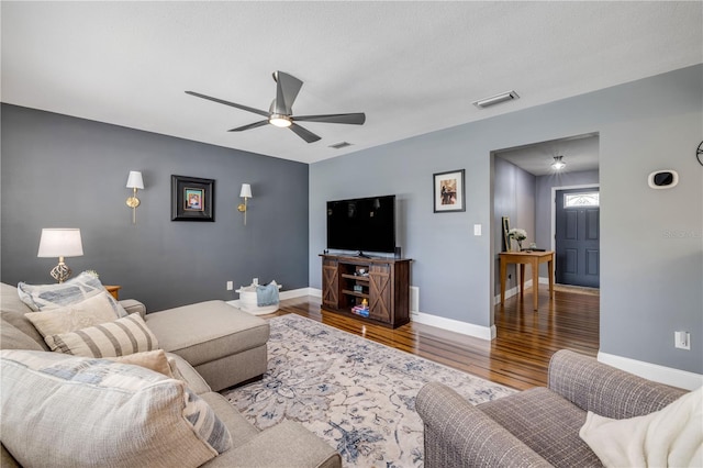 2548 E Compton St, Orlando, FL 32806 - living area with visible vents, baseboards, ceiling fan, and wood finished floors