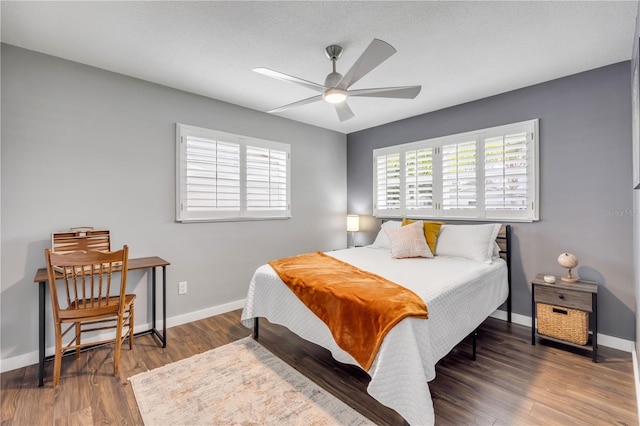 2548 E Compton St, Orlando, FL 32806 - bedroom featuring baseboards, ceiling fan, and wood finished floors