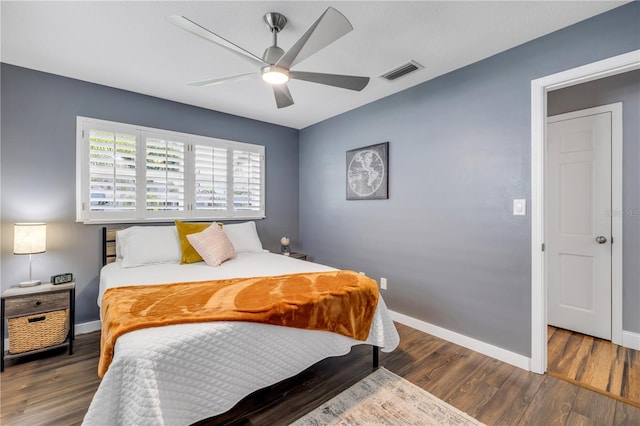 2548 E Compton St, Orlando, FL 32806 - bedroom with baseboards, visible vents, and wood finished floors