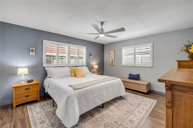 2548 E Compton St, Orlando, FL 32806 - bedroom featuring a ceiling fan, baseboards, and wood finished floors