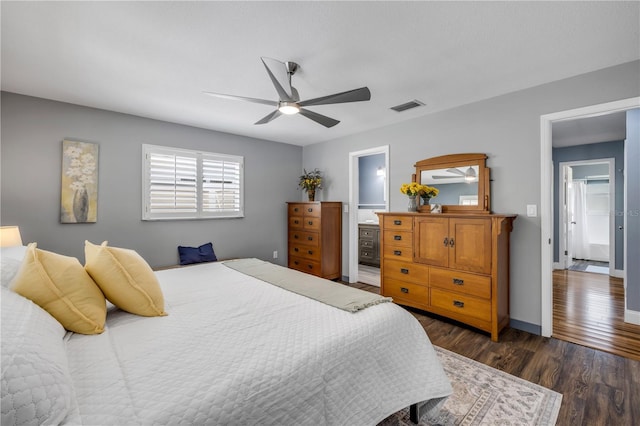 2548 E Compton St, Orlando, FL 32806 - bedroom featuring ceiling fan, visible vents, dark wood finished floors, baseboards, and connected bathroom