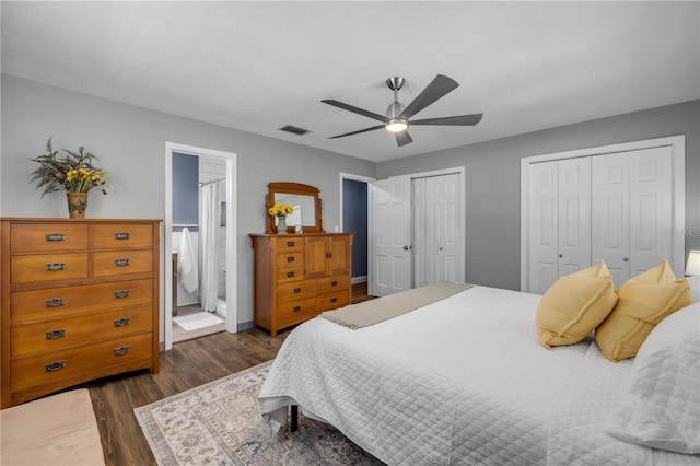 2548 E Compton St, Orlando, FL 32806 - bedroom featuring ceiling fan, dark wood finished floors, two closets, baseboards, and visible vents