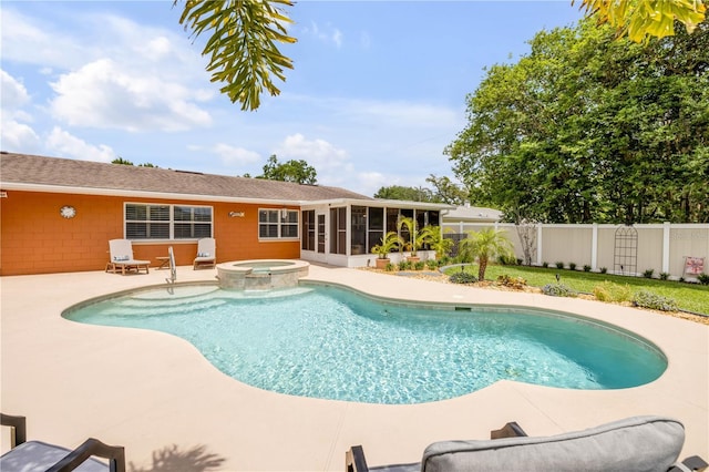 2548 E Compton St, Orlando, FL 32806 - view of swimming pool with a sunroom, a fenced backyard, a pool with connected hot tub, and a patio