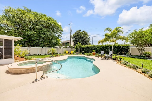 2548 E Compton St, Orlando, FL 32806 - view of swimming pool featuring a sunroom, a pool with connected hot tub, a fenced backyard, and a patio area