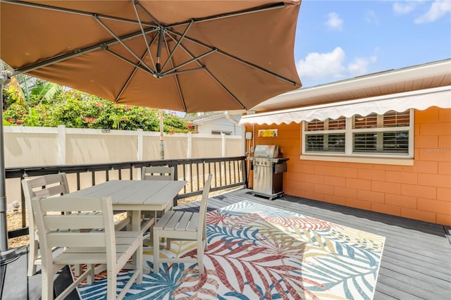 2548 E Compton St, Orlando, FL 32806 - deck with fence, outdoor dining space, and area for grilling