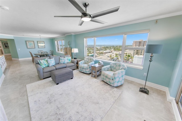 living room featuring crown molding, baseboards, ceiling fan, and a city view
