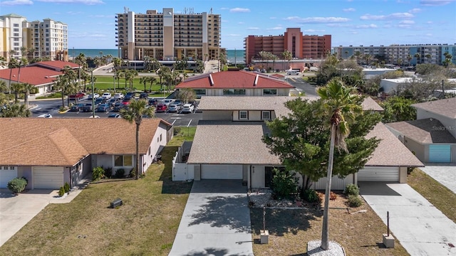 drone / aerial view with a water view and a city view