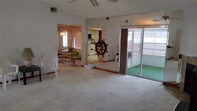 1077 Willow Wood Dr, Port Orange, FL 32129 - living area featuring ceiling fan, lofted ceiling, and carpet flooring