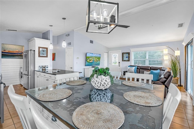 dining area with visible vents, light tile patterned floors, and a chandelier