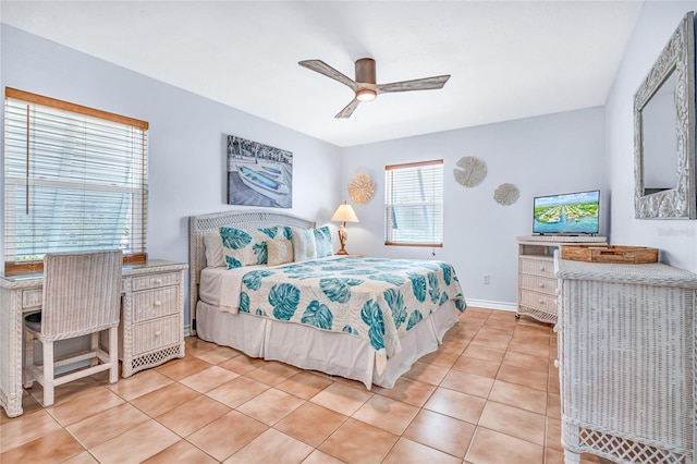 bedroom featuring baseboards, ceiling fan, and light tile patterned floors