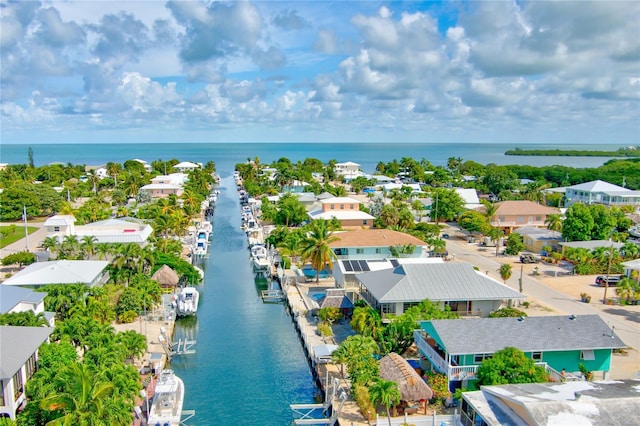 birds eye view of property featuring a residential view and a water view
