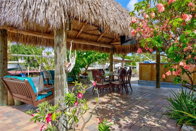 view of patio / terrace with a gazebo and outdoor dining space