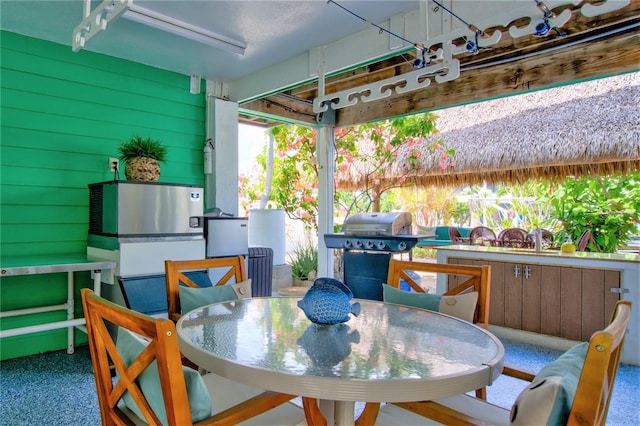 view of patio / terrace with outdoor dining space and grilling area