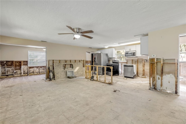431 Palmetto St, Edgewater, FL 32132 - living area with healthy amount of natural light, ceiling fan, and a textured ceiling