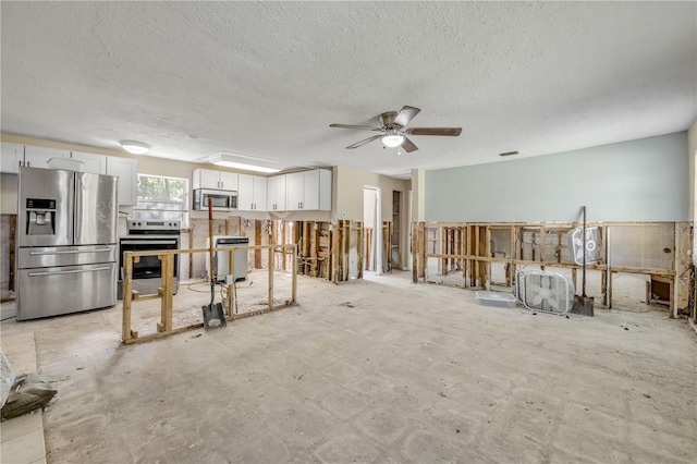431 Palmetto St, Edgewater, FL 32132 - living room with a ceiling fan and a textured ceiling