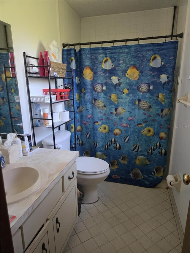 bathroom featuring vanity, tile patterned floors, toilet, and a shower with curtain