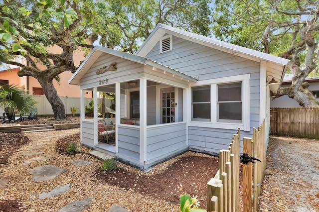 view of side of property with fence
