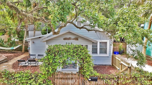 view of side of home with fence