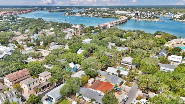 drone / aerial view featuring a residential view and a water view