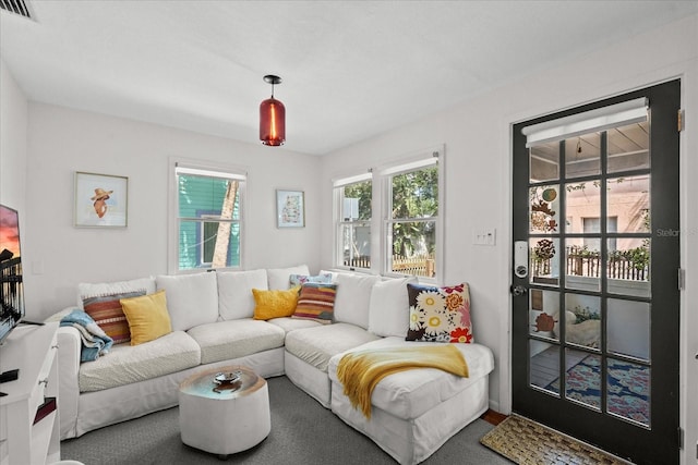 living room featuring visible vents