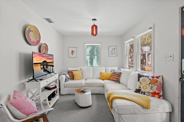 living room featuring carpet flooring and visible vents