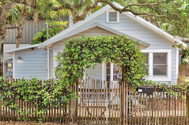 view of front facade featuring fence