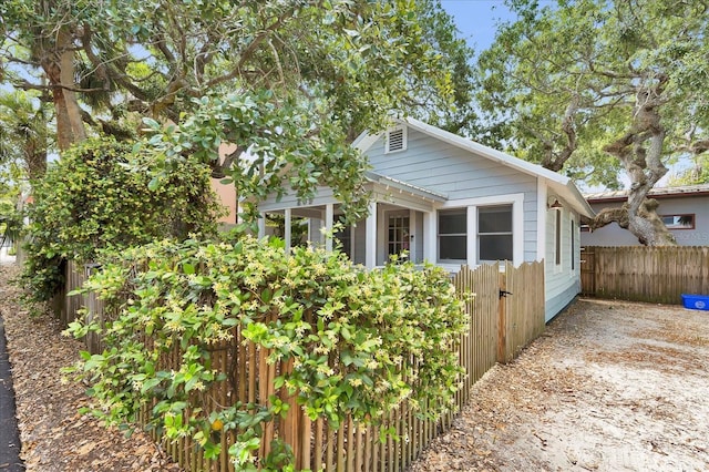 view of home's exterior featuring fence