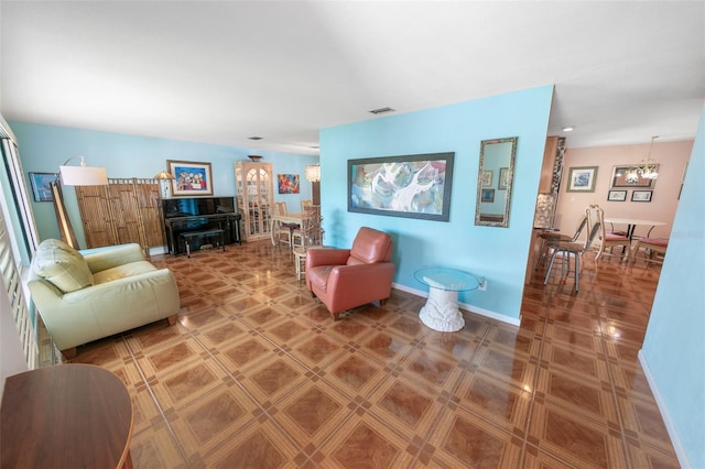 4350 Candlewood Ln, Ponce Inlet, FL 32127 - living room featuring an inviting chandelier and visible vents