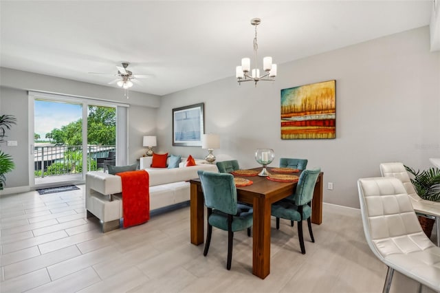 7 Riverwalk Dr Unit 205, New Smyrna Beach, FL 32169 - dining area with a chandelier, a ceiling fan, and baseboards