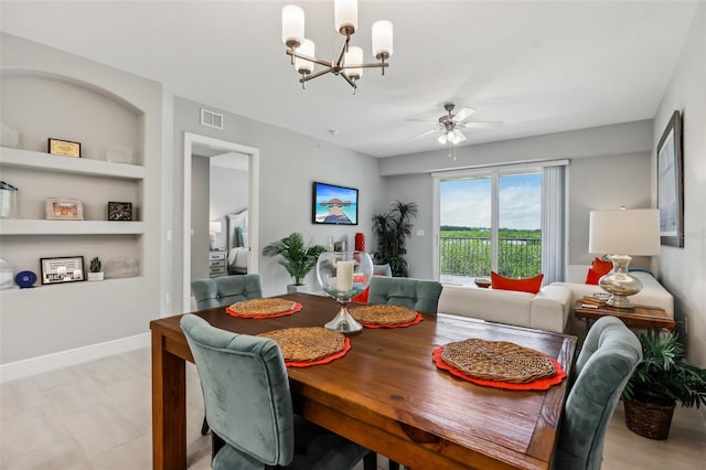 7 Riverwalk Dr Unit 205, New Smyrna Beach, FL 32169 - dining space featuring built in features, a chandelier, and ceiling fan