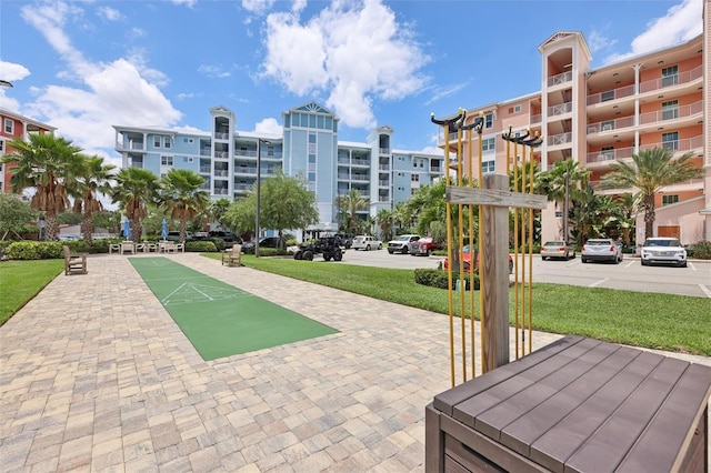 7 Riverwalk Dr Unit 205, New Smyrna Beach, FL 32169 - view of property's community featuring shuffleboard and a yard