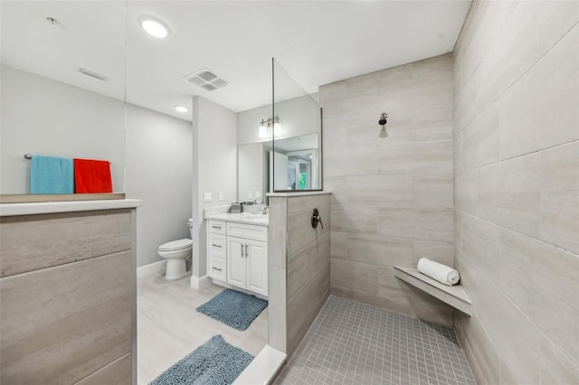 7 Riverwalk Dr Unit 205, New Smyrna Beach, FL 32169 - full bath featuring vanity, toilet, tiled shower, and tile patterned floors