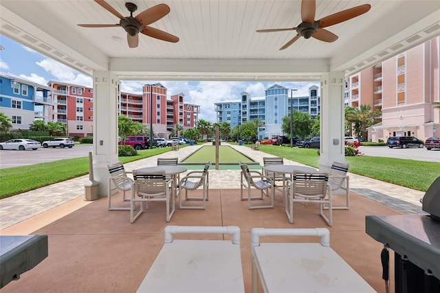 7 Riverwalk Dr Unit 205, New Smyrna Beach, FL 32169 - view of patio / terrace featuring ceiling fan, a bocce ball area, and outdoor dining area