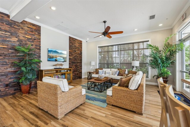 7 Riverwalk Dr Unit 205, New Smyrna Beach, FL 32169 - living area with wood finished floors, a ceiling fan, ornamental molding, recessed lighting, and baseboards