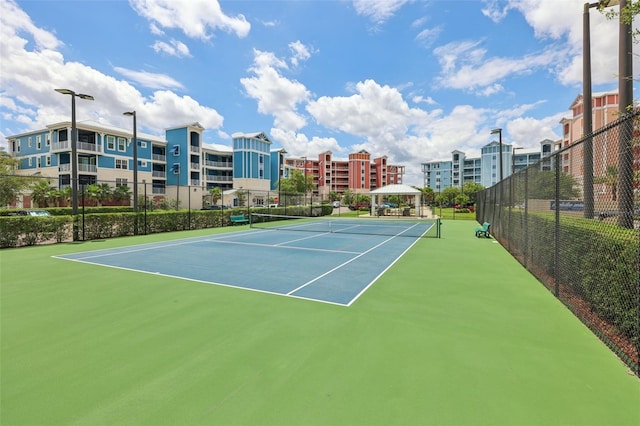 7 Riverwalk Dr Unit 205, New Smyrna Beach, FL 32169 - view of tennis court featuring fence and community basketball court