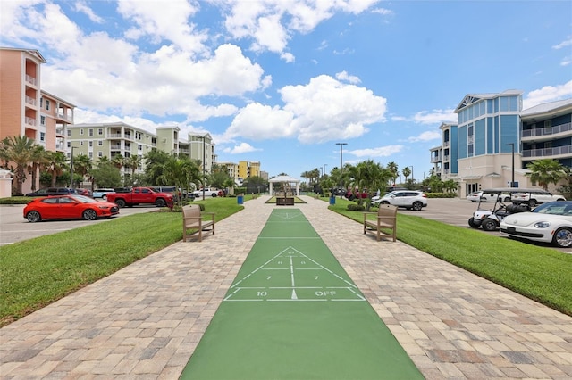 7 Riverwalk Dr Unit 205, New Smyrna Beach, FL 32169 - view of community featuring a yard, a gazebo, uncovered parking, and shuffleboard