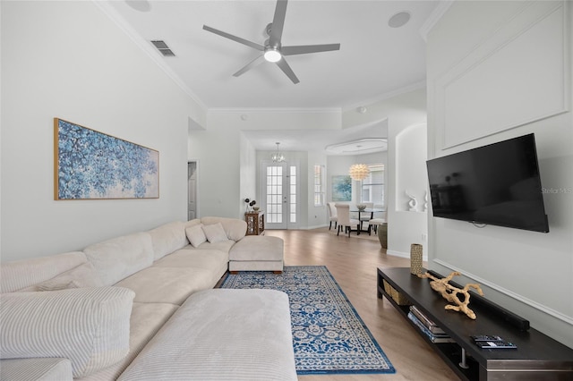11222 Rapallo Ln, Windermere, FL 34786 - living area featuring ornamental molding, light wood finished floors, a chandelier, ceiling fan, and baseboards