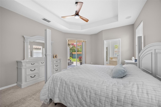 11222 Rapallo Ln, Windermere, FL 34786 - bedroom with access to exterior, a tray ceiling, light colored carpet, and multiple windows