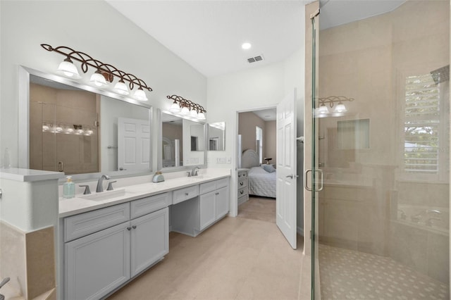 11222 Rapallo Ln, Windermere, FL 34786 - ensuite bathroom featuring double vanity, a shower stall, and tile patterned flooring